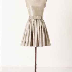 Gold shimmer low back party dress. Bow in back.